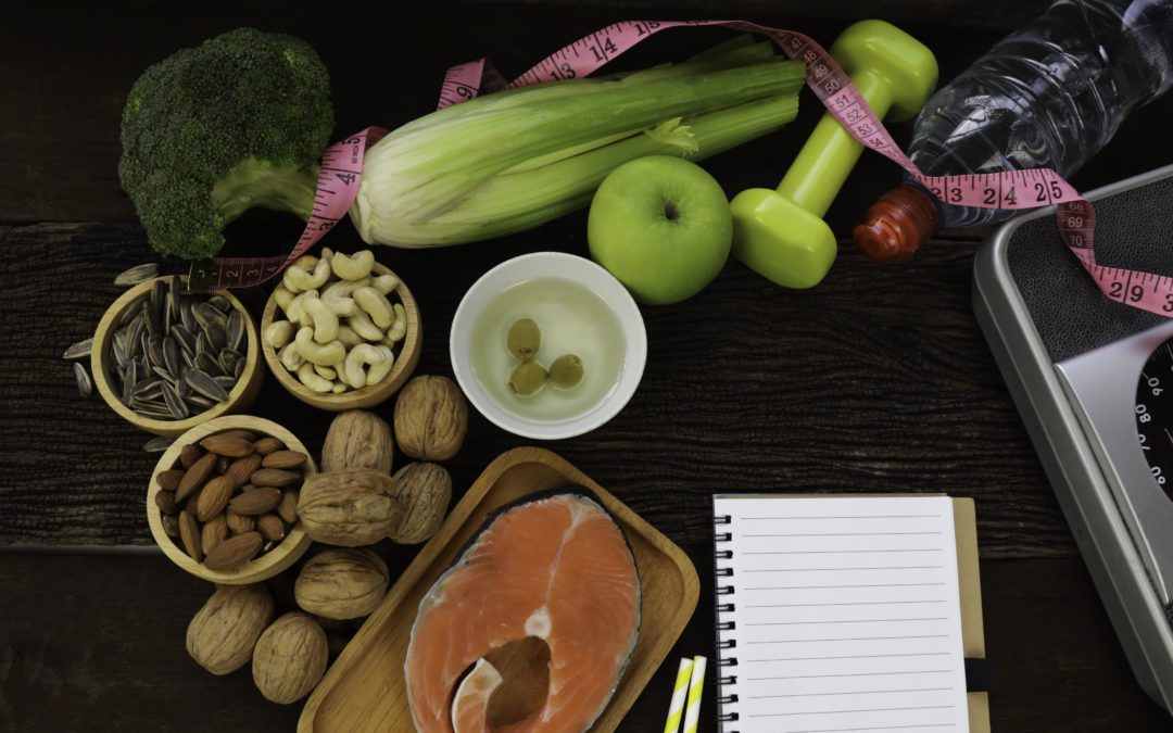 Healthy low carbs products including nuts, broccoli, fish, celery, and a bottle of water